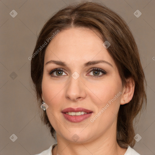 Joyful white adult female with medium  brown hair and brown eyes