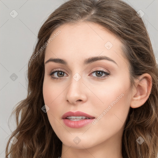 Joyful white young-adult female with long  brown hair and blue eyes