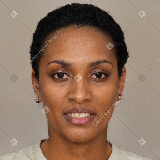 Joyful black young-adult female with short  black hair and brown eyes