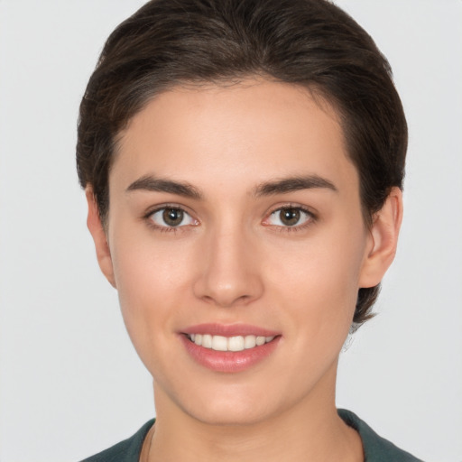 Joyful white young-adult female with short  brown hair and brown eyes