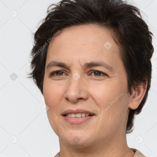 Joyful white adult female with short  brown hair and brown eyes