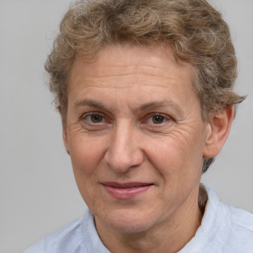 Joyful white middle-aged male with short  brown hair and brown eyes