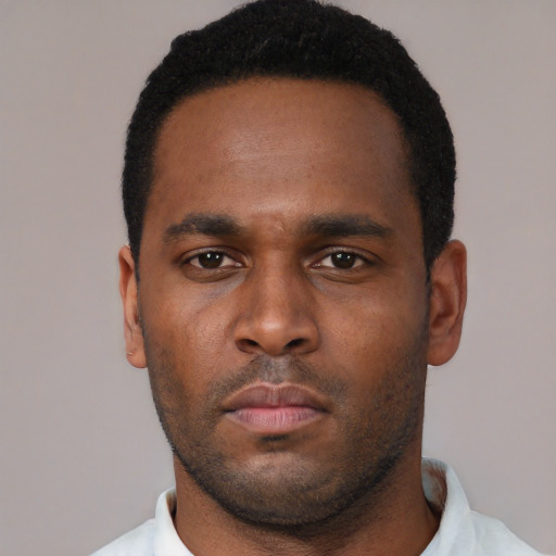 Neutral black young-adult male with short  black hair and brown eyes