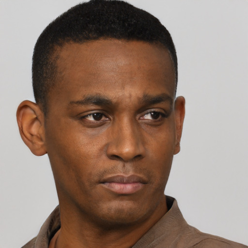 Neutral black young-adult male with short  black hair and brown eyes