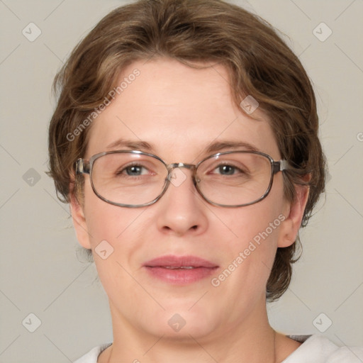 Joyful white adult female with medium  brown hair and blue eyes