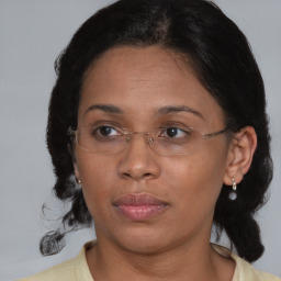 Joyful asian adult female with medium  brown hair and brown eyes