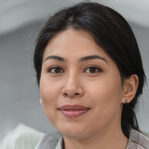 Joyful white adult female with medium  brown hair and brown eyes
