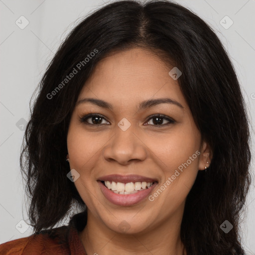 Joyful latino young-adult female with long  brown hair and brown eyes