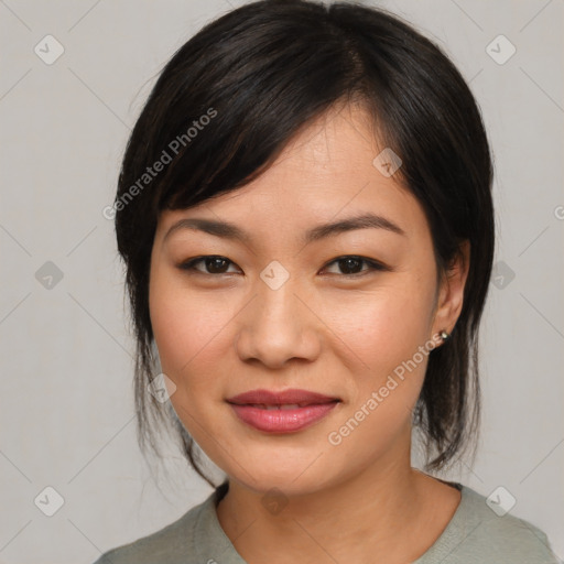 Joyful asian young-adult female with medium  black hair and brown eyes