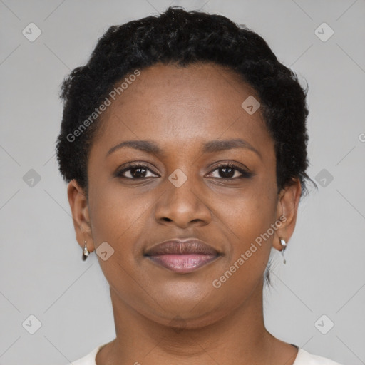 Joyful black young-adult female with short  black hair and brown eyes