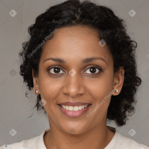 Joyful black young-adult female with medium  brown hair and brown eyes