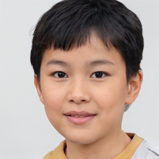 Joyful asian child female with short  brown hair and brown eyes