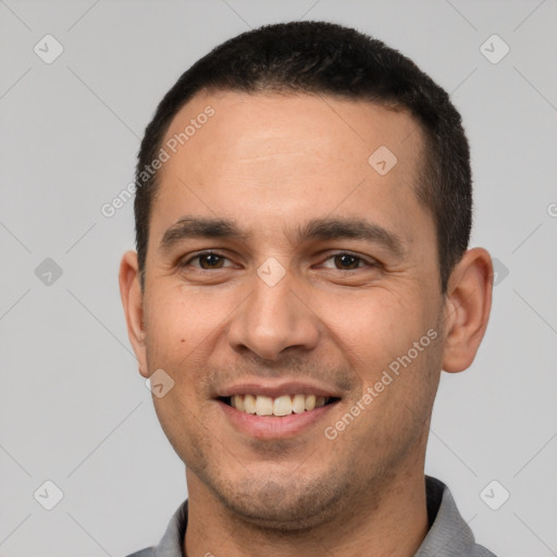 Joyful white young-adult male with short  brown hair and brown eyes