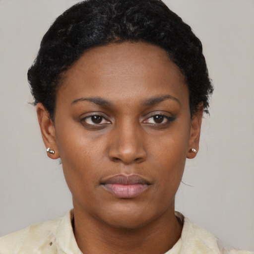 Neutral black young-adult female with short  brown hair and brown eyes