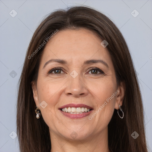 Joyful white adult female with long  brown hair and grey eyes