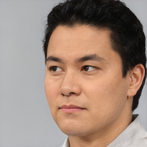 Neutral asian young-adult male with short  black hair and brown eyes