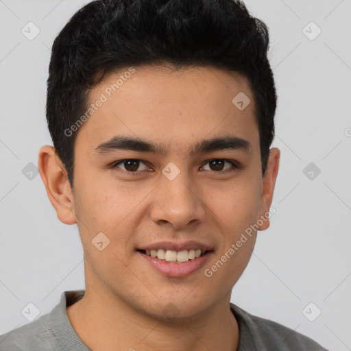 Joyful latino young-adult male with short  brown hair and brown eyes