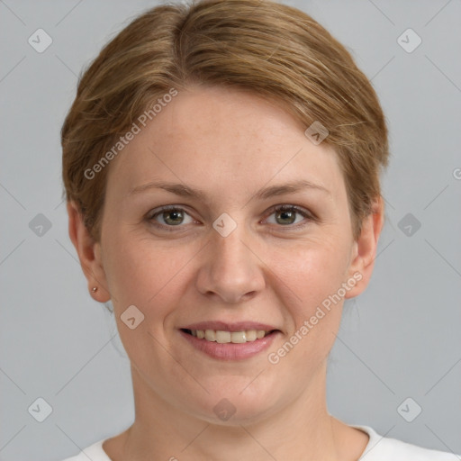 Joyful white adult female with short  brown hair and grey eyes