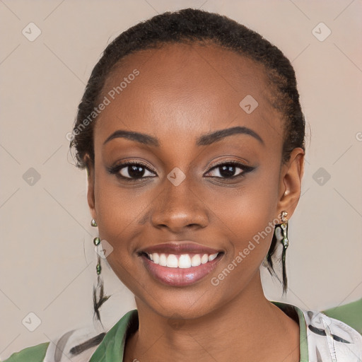 Joyful black young-adult female with short  black hair and brown eyes