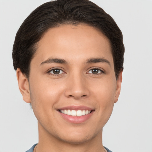 Joyful white young-adult female with short  brown hair and brown eyes