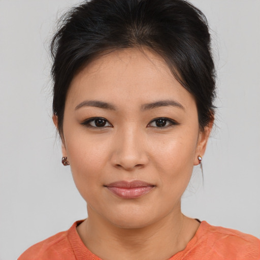 Joyful asian young-adult female with medium  brown hair and brown eyes