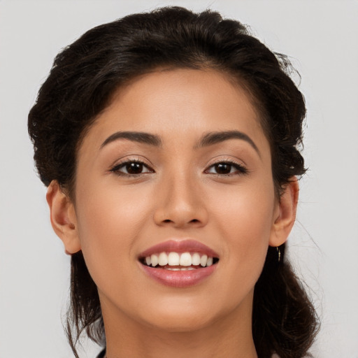 Joyful white young-adult female with long  brown hair and brown eyes