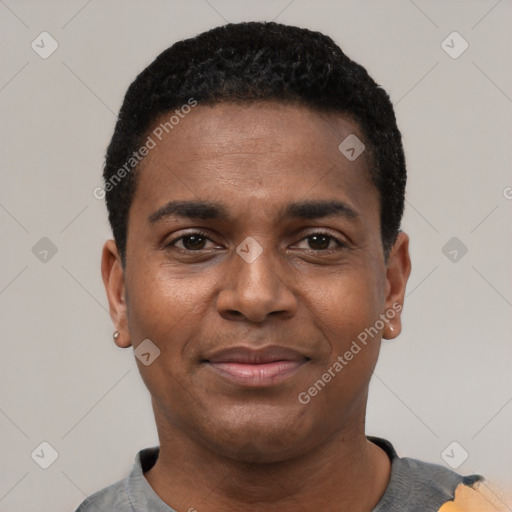 Joyful black young-adult male with short  black hair and brown eyes