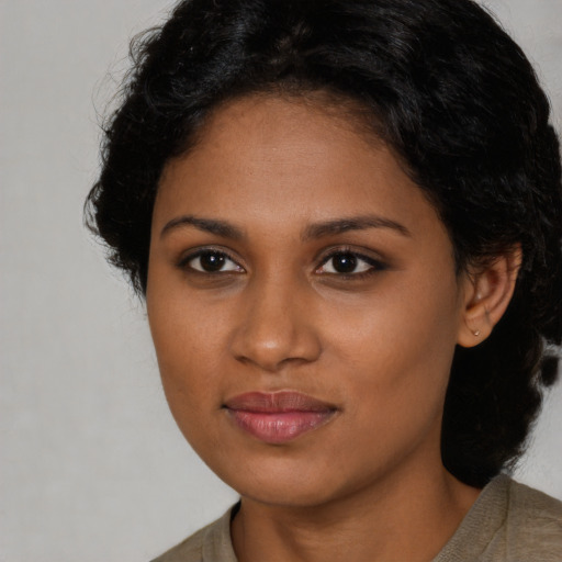 Neutral black young-adult female with long  brown hair and brown eyes