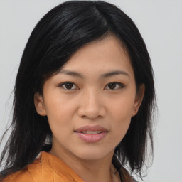 Joyful asian young-adult female with medium  black hair and brown eyes