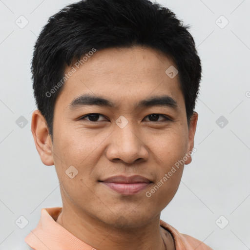 Joyful asian young-adult male with short  black hair and brown eyes