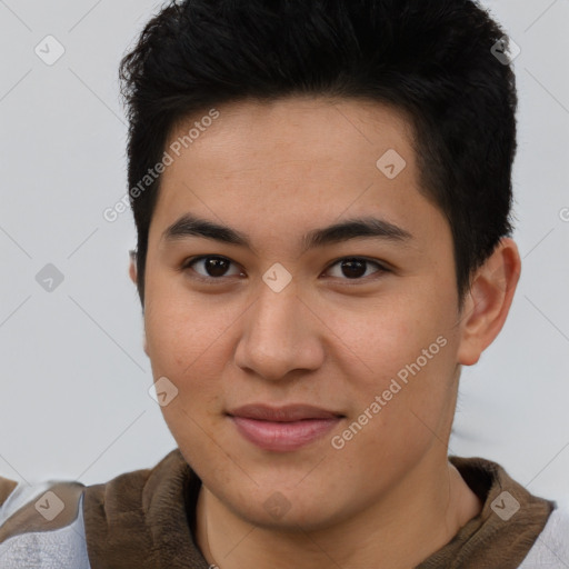 Joyful asian young-adult male with short  brown hair and brown eyes