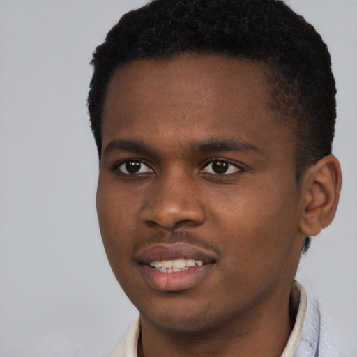 Joyful black young-adult male with short  brown hair and brown eyes
