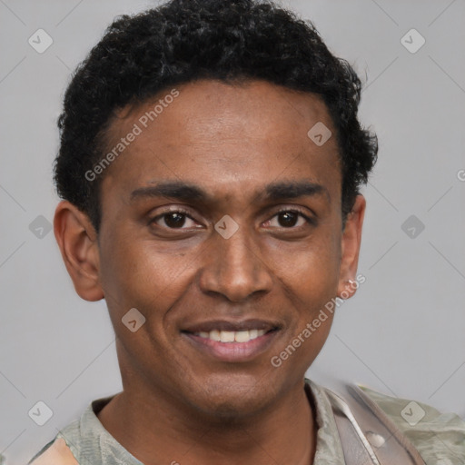 Joyful black young-adult male with short  black hair and brown eyes