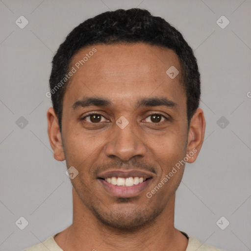 Joyful latino young-adult male with short  black hair and brown eyes