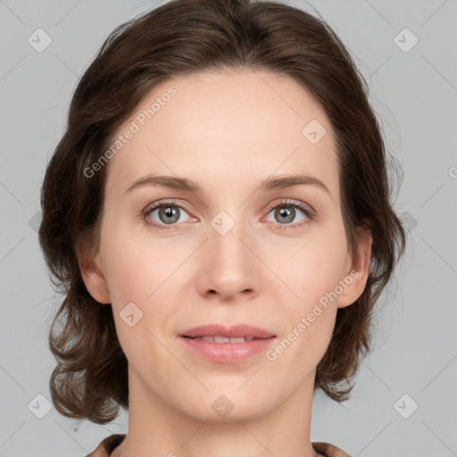 Joyful white young-adult female with medium  brown hair and green eyes