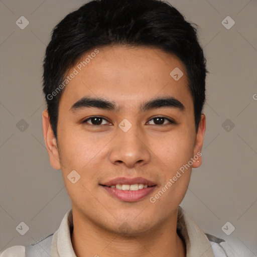 Joyful latino young-adult male with short  brown hair and brown eyes