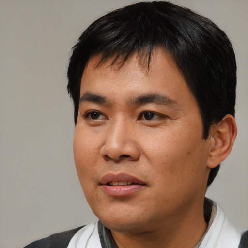 Neutral asian young-adult male with short  black hair and brown eyes