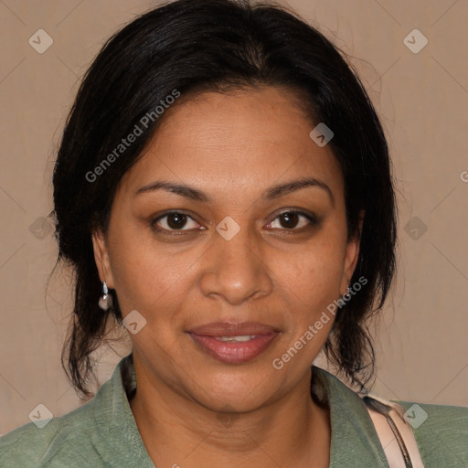 Joyful black adult female with medium  brown hair and brown eyes