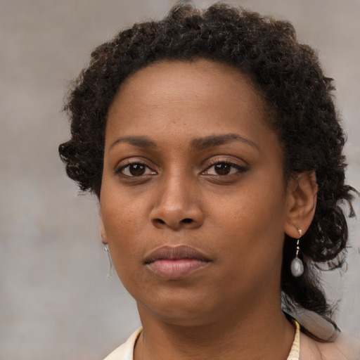 Neutral black young-adult female with short  brown hair and brown eyes