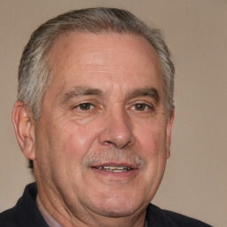 Neutral white middle-aged male with short  gray hair and brown eyes