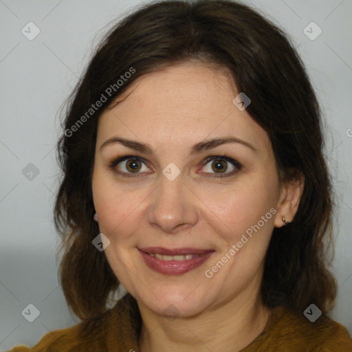 Joyful white adult female with medium  brown hair and brown eyes