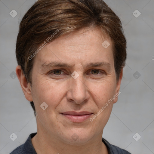 Joyful white adult female with short  brown hair and grey eyes