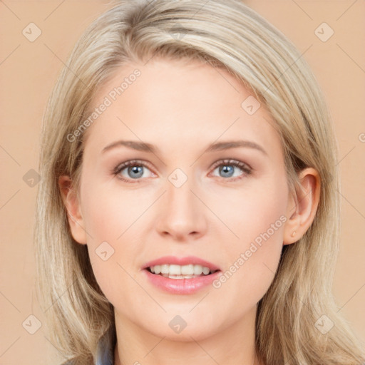 Joyful white young-adult female with long  brown hair and blue eyes