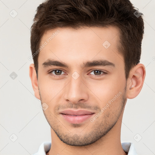 Joyful white young-adult male with short  brown hair and brown eyes