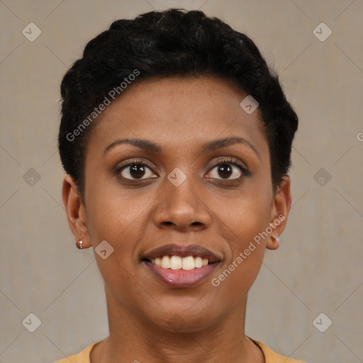 Joyful black young-adult female with short  black hair and brown eyes