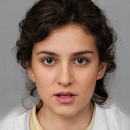 Neutral white young-adult female with medium  brown hair and brown eyes