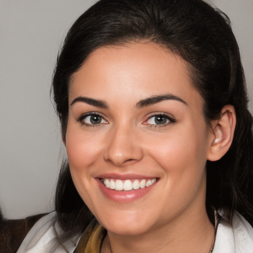 Joyful white young-adult female with medium  brown hair and brown eyes