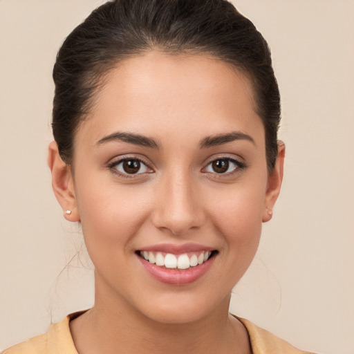 Joyful white young-adult female with medium  brown hair and brown eyes