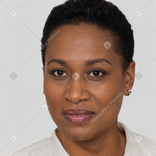 Joyful black young-adult female with short  black hair and brown eyes