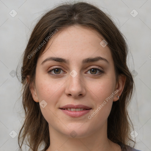 Joyful white young-adult female with medium  brown hair and grey eyes